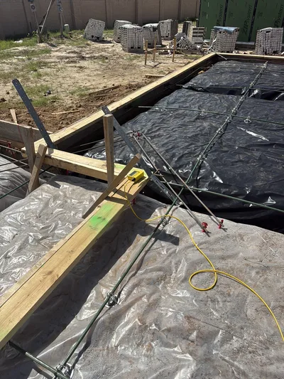 Zip Level elevation-measurement device set up on a foundation form before a concrete pour.